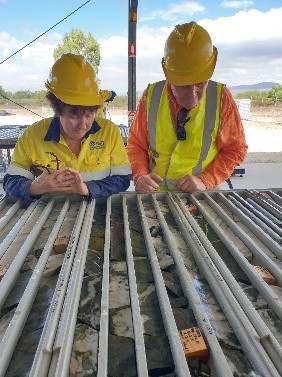 Plate 2 Justine Thorp and Athy Nye discussing core samples, Mt Carbine Mine.jpg