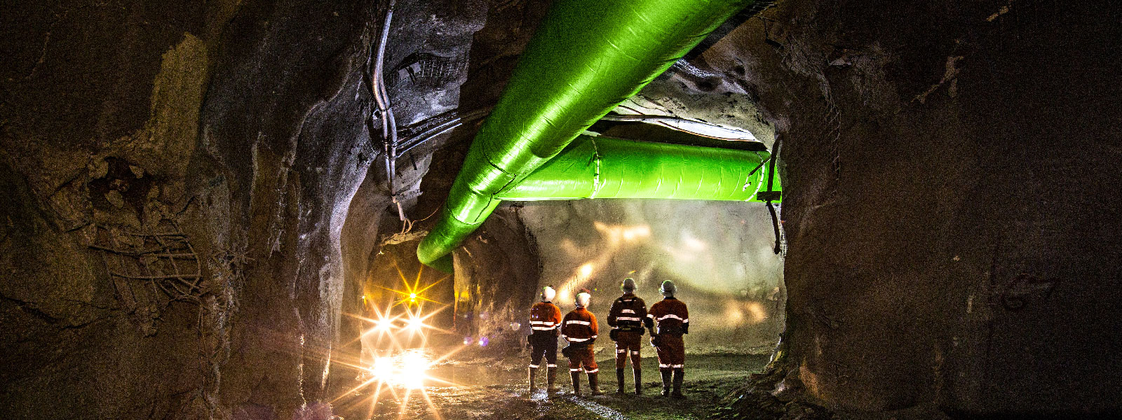 Miners inspecting an underground ventilation system in a gold mine in Australia