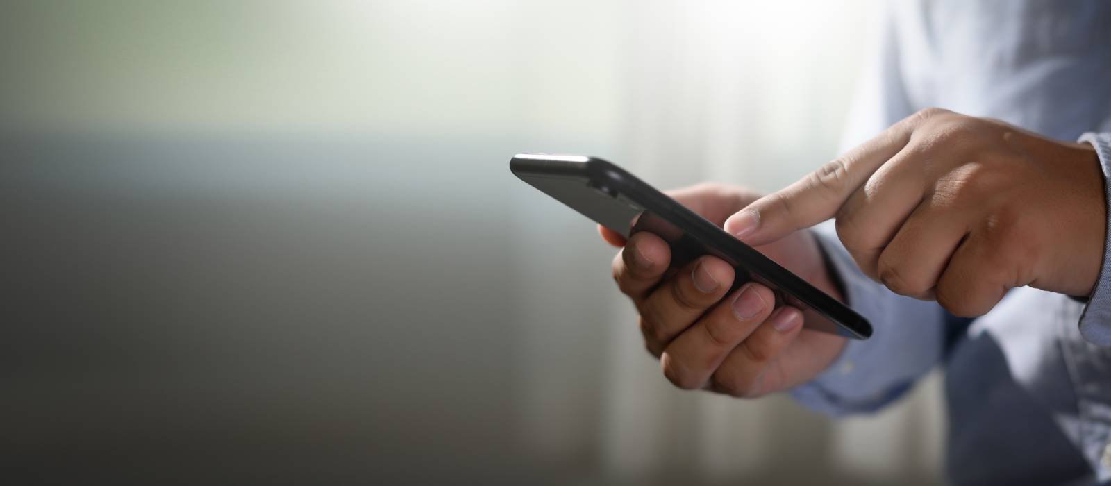 Man using a smart phone Man using a smart phone