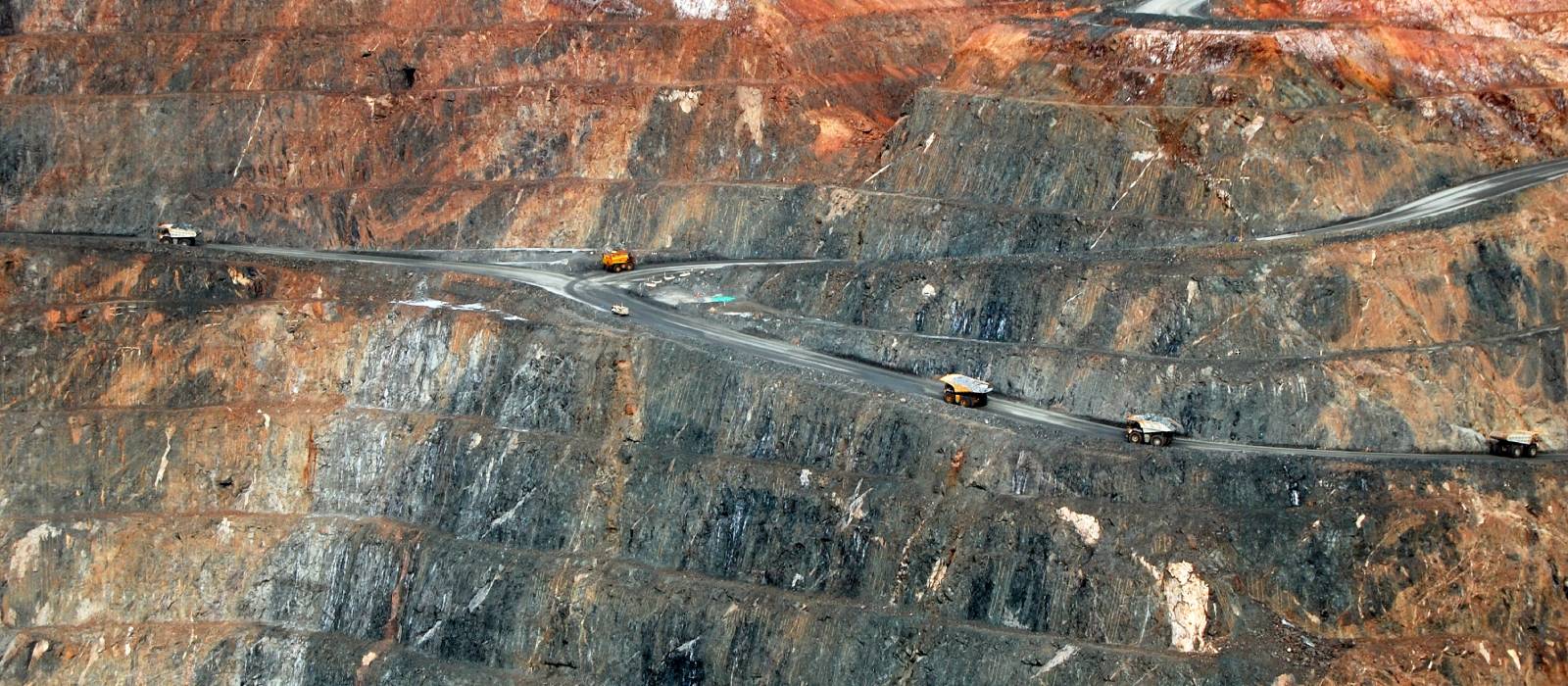 Trucks driving in an open cut mine