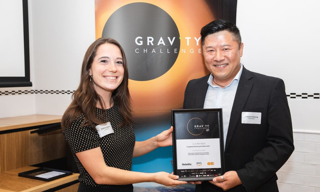 Lux Aerobot’s Katrina Albert receives a GRAVITY Challenge Award from Oz Minerals’ Richard Cheung during Space Week in Adelaide, November 2019.