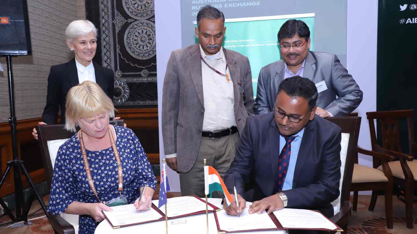 Janine Herzig (AusIMM) and Devi Prasad Mishra (IITISM) sign the MOU.